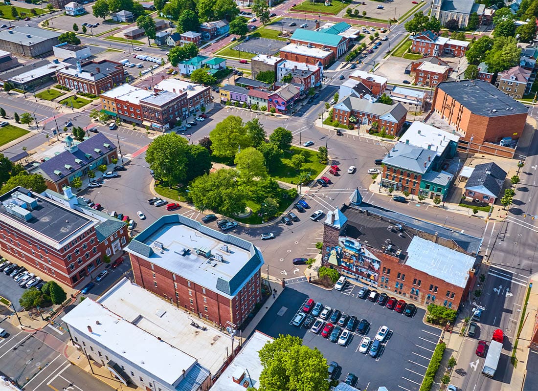 Logan, OH - Aerial Small Town Mount Vernon With Green Park in Center and Parking Lots